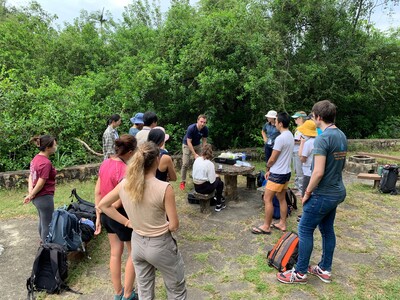 Participants attentively learn  the techniques of eDNA sampling.